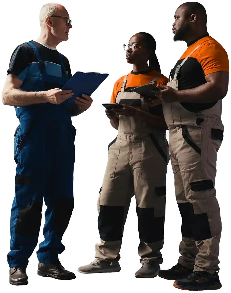 Three workers discussing in protective gear.